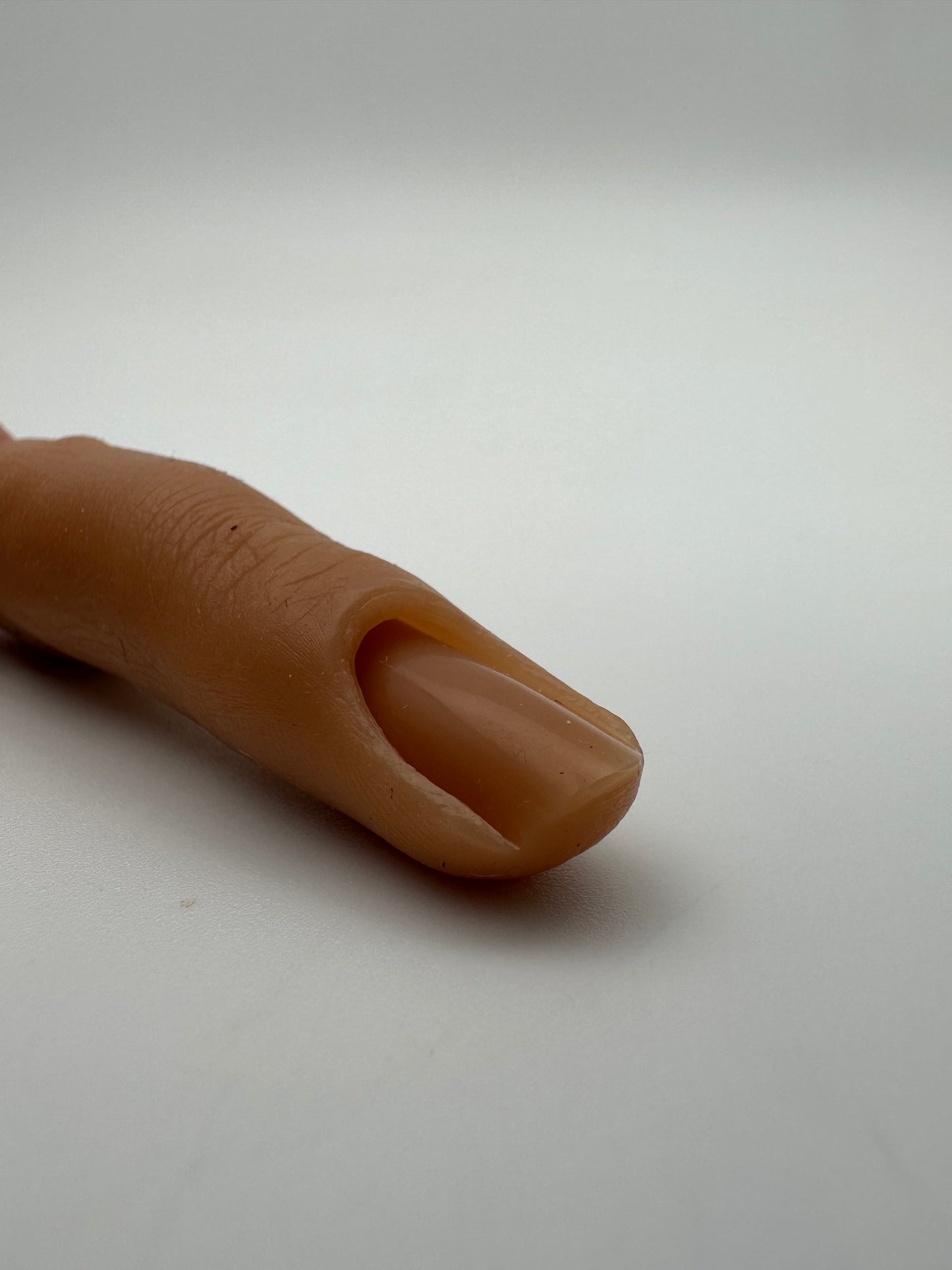 Training finger with attachment