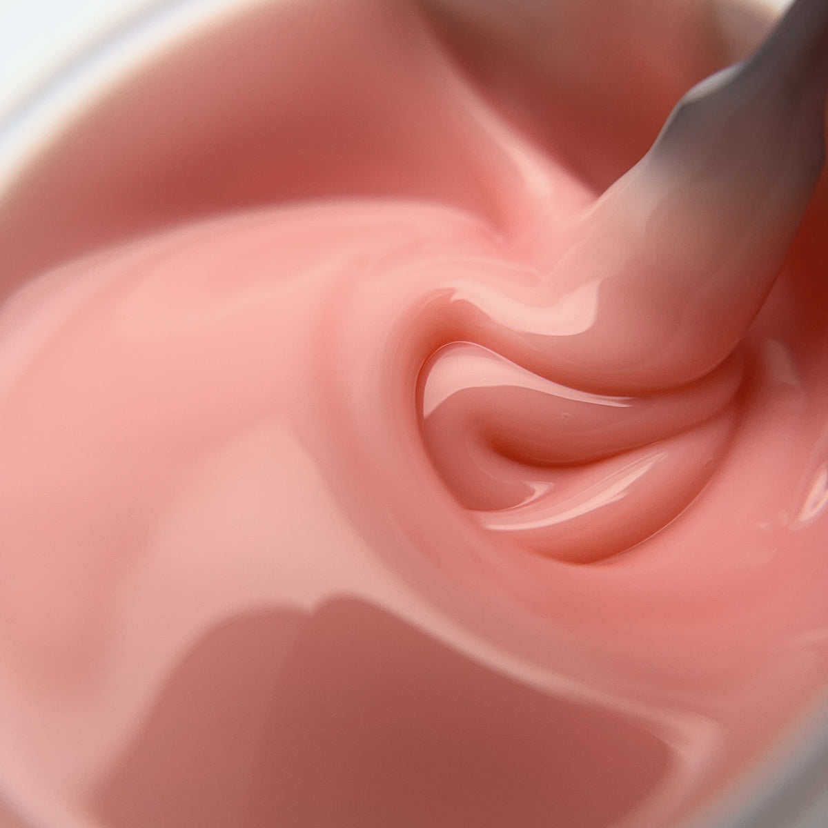 Soft peach nude builder gel for elegant salon nail designs