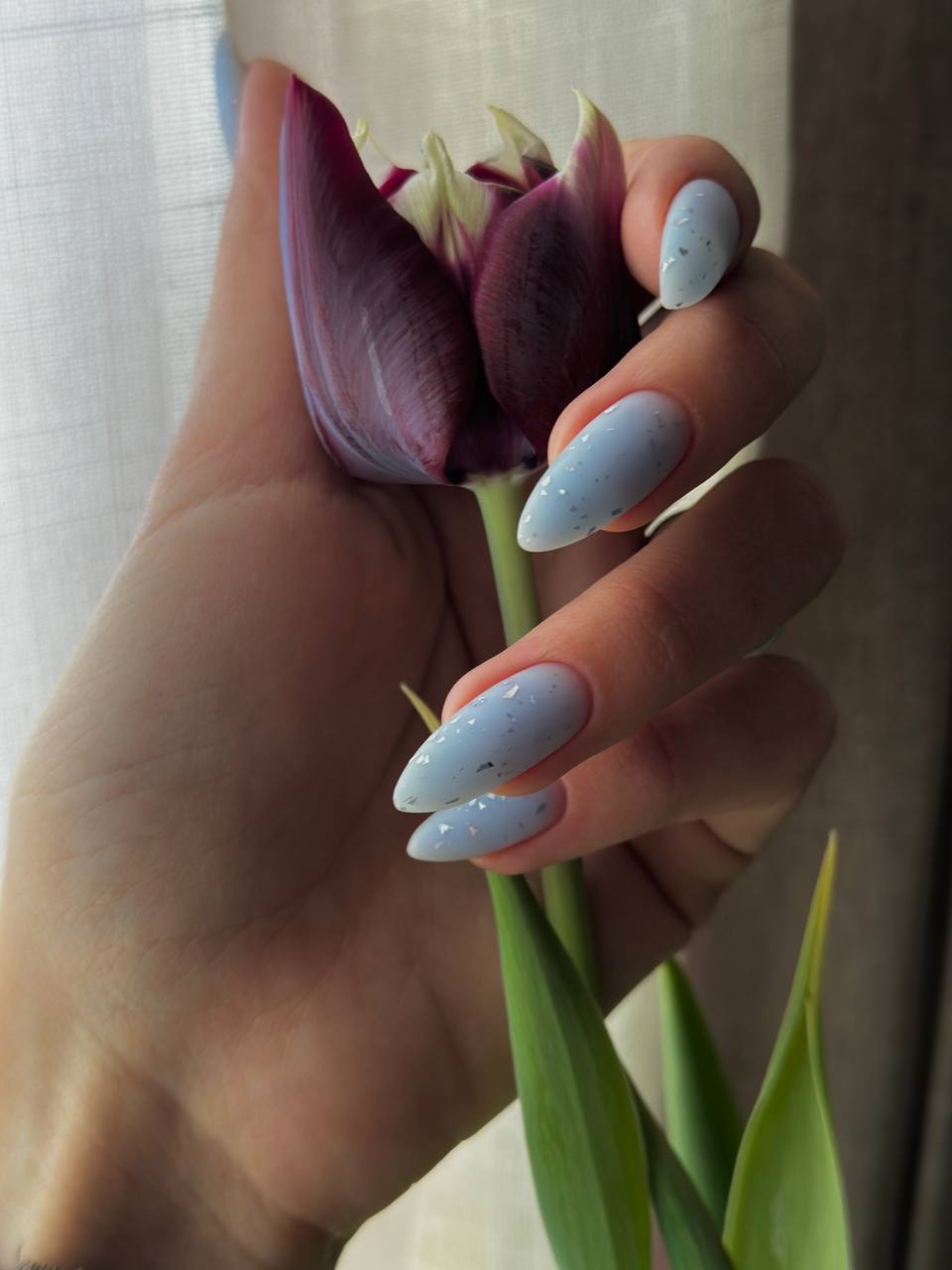 Blue-green Wave builder gel applied on professional nail tips